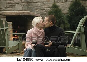 Stock Photography - romantic couple 
drinking wine 
by fireplace. 
fotosearch - search 
stock photos, 
pictures, images, 
and photo clipart