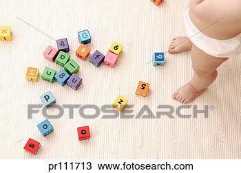 Stock Photo - toddler playing 
with toy blocks. 
fotosearch - search 
stock photos, 
pictures, images, 
and photo clipart