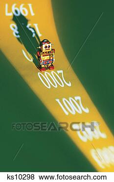 Stock Photo - toy robot on projected 
dates. fotosearch 
- search stock 
photos, pictures, 
images, and photo 
clipart