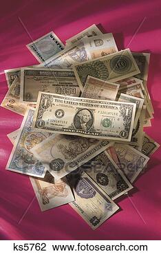 Stock Photo - united states 
dollar on top 
of international 
currency. fotosearch 
- search stock 
photos, pictures, 
images, and photo 
clipart