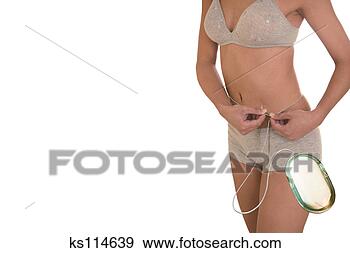 Stock Photograph - woman measuring 
her waist. fotosearch 
- search stock 
photos, pictures, 
images, and photo 
clipart