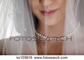 Stock Photo - woman's face with 
wedding veil and 
pearl necklace, 
no eyes shown. 
fotosearch - search 
stock photos, 
pictures, images, 
and photo clipart