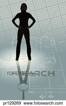 Stock Photograph - architect standing 
on blueprints 
and casting compass 
shadow. fotosearch 
- search stock 
photos, pictures, 
images, and photo 
clipart