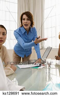 Stock Photography - serious businesswoman 
gesturing and 
talking. fotosearch 
- search stock 
photos, pictures, 
images, and photo 
clipart