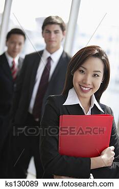 Stock Photograph - businesswoman 
with coworkers. 
fotosearch - search 
stock photos, 
pictures, images, 
and photo clipart