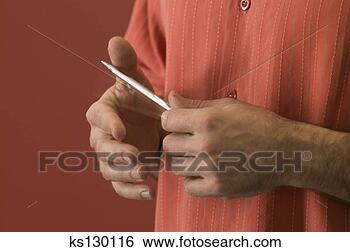 Stock Photo - man holding a 
pen. fotosearch 
- search stock 
photos, pictures, 
images, and photo 
clipart