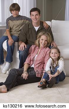 Stock Photo - family sitting 
in the living 
room. fotosearch 
- search stock 
photos, pictures, 
images, and photo 
clipart