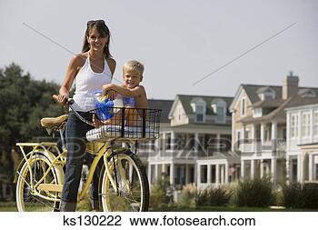 Stock Photo - mother and son 
on a bike. fotosearch 
- search stock 
photos, pictures, 
images, and photo 
clipart