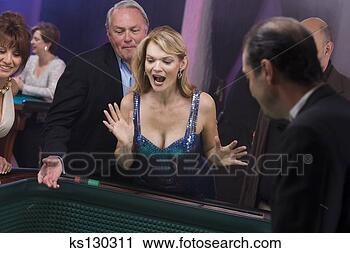 Stock Photography - woman excited 
to gamble. fotosearch 
- search stock 
photos, pictures, 
images, and photo 
clipart