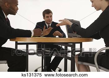 Stock Image - businesspeople 
gesturing and 
conversing during 
meeting. fotosearch 
- search stock 
photos, pictures, 
images, and photo 
clipart