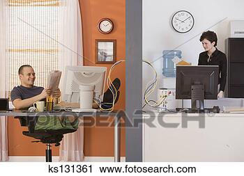 Stock Photography - man relaxing in 
home office and 
businesswoman 
at work. fotosearch 
- search stock 
photos, pictures, 
images, and photo 
clipart