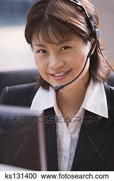 Stock Photography - smiling business 
woman with hands-free 
headaet. fotosearch 
- search stock 
photos, pictures, 
images, and photo 
clipart
