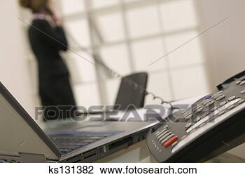 Stock Photo - telephone and 
laptop. fotosearch 
- search stock 
photos, pictures, 
images, and photo 
clipart
