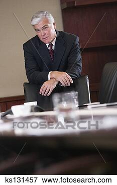 Picture - serious businessman 
at conference 
table. fotosearch 
- search stock 
photos, pictures, 
images, and photo 
clipart
