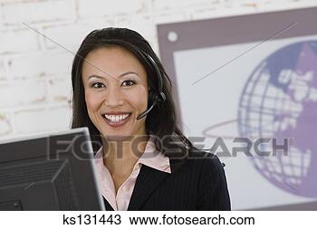 Stock Photo - smiling telemarketer 
with headset. 
fotosearch - search 
stock photos, 
pictures, images, 
and photo clipart