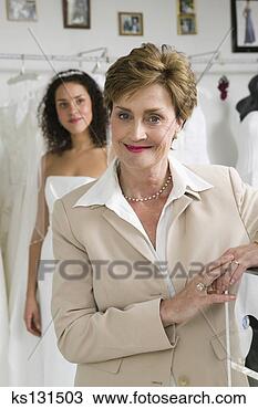 Stock Photo - smiling woman 
at bridal store. 
fotosearch - search 
stock photos, 
pictures, images, 
and photo clipart
