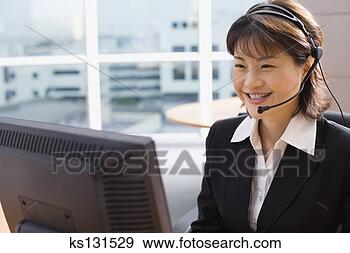 Stock Photograph - smiling telemarketer 
with headset. 
fotosearch - search 
stock photos, 
pictures, images, 
and photo clipart