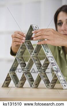Stock Photography - woman stacking 
money. fotosearch 
- search stock 
photos, pictures, 
images, and photo 
clipart