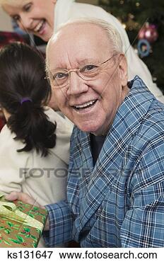 Picture - smiling man during 
christmas. fotosearch 
- search stock 
photos, pictures, 
images, and photo 
clipart