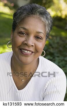 Stock Photo - smiling woman 
outdoors. fotosearch 
- search stock 
photos, pictures, 
images, and photo 
clipart