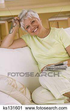 Stock Photography - smiling woman 
relaxing at home. 
fotosearch - search 
stock photos, 
pictures, images, 
and photo clipart