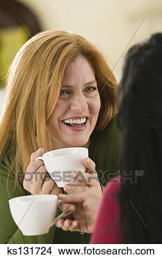 Stock Photo - smiling woman 
chatting over 
cup of coffee. 
fotosearch - search 
stock photos, 
pictures, images, 
and photo clipart