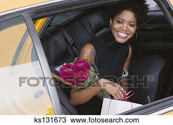 Stock Photo - woman with flowers 
leaving taxi. 
fotosearch - search 
stock photos, 
pictures, images, 
and photo clipart