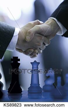 Stock Photo - businessmen shaking 
hands over chessboard. 
fotosearch - search 
stock photos, 
pictures, images, 
and photo clipart