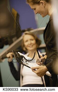 Stock Photo - woman with fitness 
instructor. fotosearch 
- search stock 
photos, pictures, 
images, and photo 
clipart