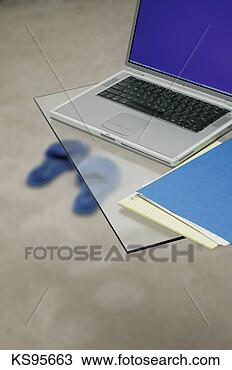 Stock Photo - laptop on desk, 
slippers on floor. 
fotosearch - search 
stock photos, 
pictures, images, 
and photo clipart