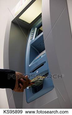Stock Photograph - person using atm. 
fotosearch - search 
stock photos, 
pictures, images, 
and photo clipart