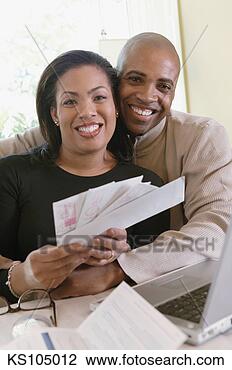Stock Photo - couple paying 
bills online, 
portrait. fotosearch 
- search stock 
photos, pictures, 
images, and photo 
clipart