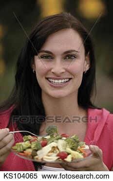 Stock Image - woman eating salad, 
portrait. fotosearch 
- search stock 
photos, pictures, 
images, and photo 
clipart