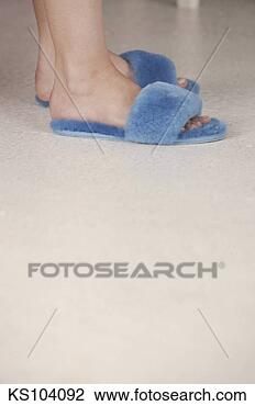 Stock Photo - woman's feet in 
slippers. fotosearch 
- search stock 
photos, pictures, 
images, and photo 
clipart