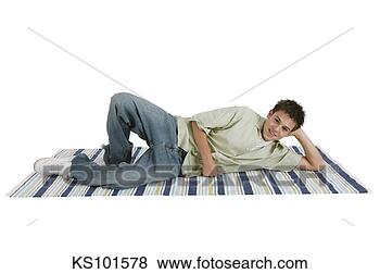 Stock Photo - teenager lying 
on rug, portrait. 
fotosearch - search 
stock photos, 
pictures, images, 
and photo clipart