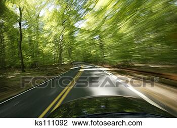 Stock Photo - car driving on 
road. fotosearch 
- search stock 
photos, pictures, 
images, and photo 
clipart