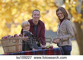 Picture - family apple picking, 
portrait. fotosearch 
- search stock 
photos, pictures, 
images, and photo 
clipart
