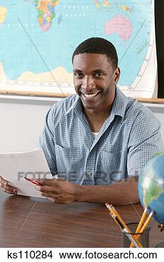 Stock Photo - teacher in classroom, 
portrait. fotosearch 
- search stock 
photos, pictures, 
images, and photo 
clipart