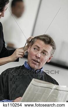 Stock Photo - woman cutting 
man's hair. fotosearch 
- search stock 
photos, pictures, 
images, and photo 
clipart