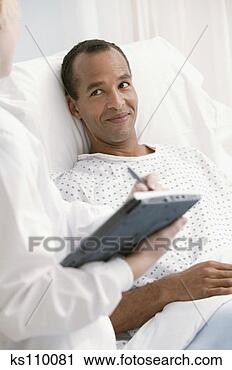 Stock Photography - patient in hospital 
bed talking to 
doctor. fotosearch 
- search stock 
photos, pictures, 
images, and photo 
clipart