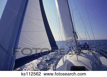 Stock Photo - young adults sailing 
in georgian bay 
lake huron, ontario, 
canada. fotosearch 
- search stock 
photos, pictures, 
images, and photo 
clipart