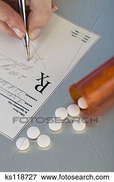 Picture - hand writing prescription, 
pills nearby. 
fotosearch - search 
stock photos, 
pictures, images, 
and photo clipart
