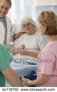 Stock Photography - medical professionals 
caring for elderly 
patient. fotosearch 
- search stock 
photos, pictures, 
images, and photo 
clipart