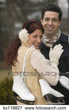 Picture - couple with ice 
skates, portrait. 
fotosearch - search 
stock photos, 
pictures, images, 
and photo clipart