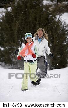 Stock Photo - mother and daughter 
playing in the 
snow. fotosearch 
- search stock 
photos, pictures, 
images, and photo 
clipart