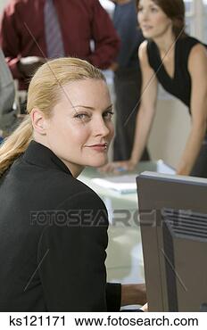 Stock Photography - portrait of a 
businesswoman, 
business people 
meeting in background. 
fotosearch - search 
stock photos, 
pictures, images, 
and photo clipart