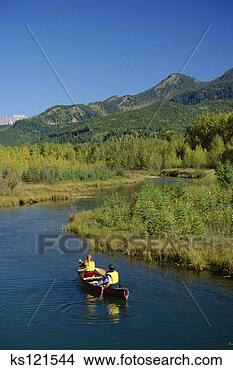 Stock Photo - couple canoeing, 
east kootenays, 
british columbia, 
canada. fotosearch 
- search stock 
photos, pictures, 
images, and photo 
clipart