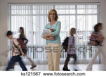 Picture - teacher standing 
in hallway and 
students walk 
past. fotosearch 
- search stock 
photos, pictures, 
images, and photo 
clipart