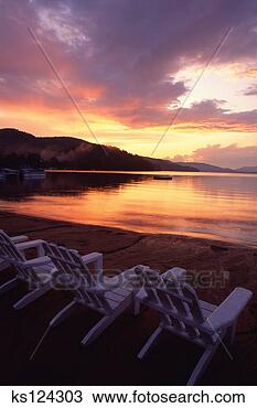 Stock Photo - chairs near body 
of water at sunset. 
fotosearch - search 
stock photos, 
pictures, images, 
and photo clipart