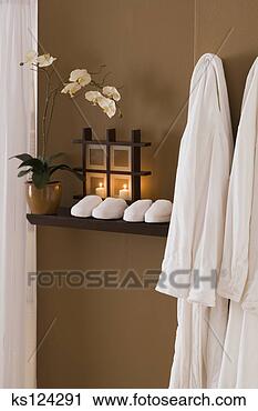 Stock Photography - still life of 
flowers, candles, 
robes, and slippers. 
fotosearch - search 
stock photos, 
pictures, images, 
and photo clipart